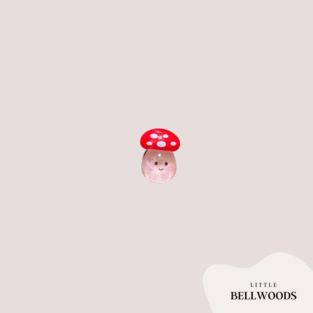 red mushroom with a smile croc charm